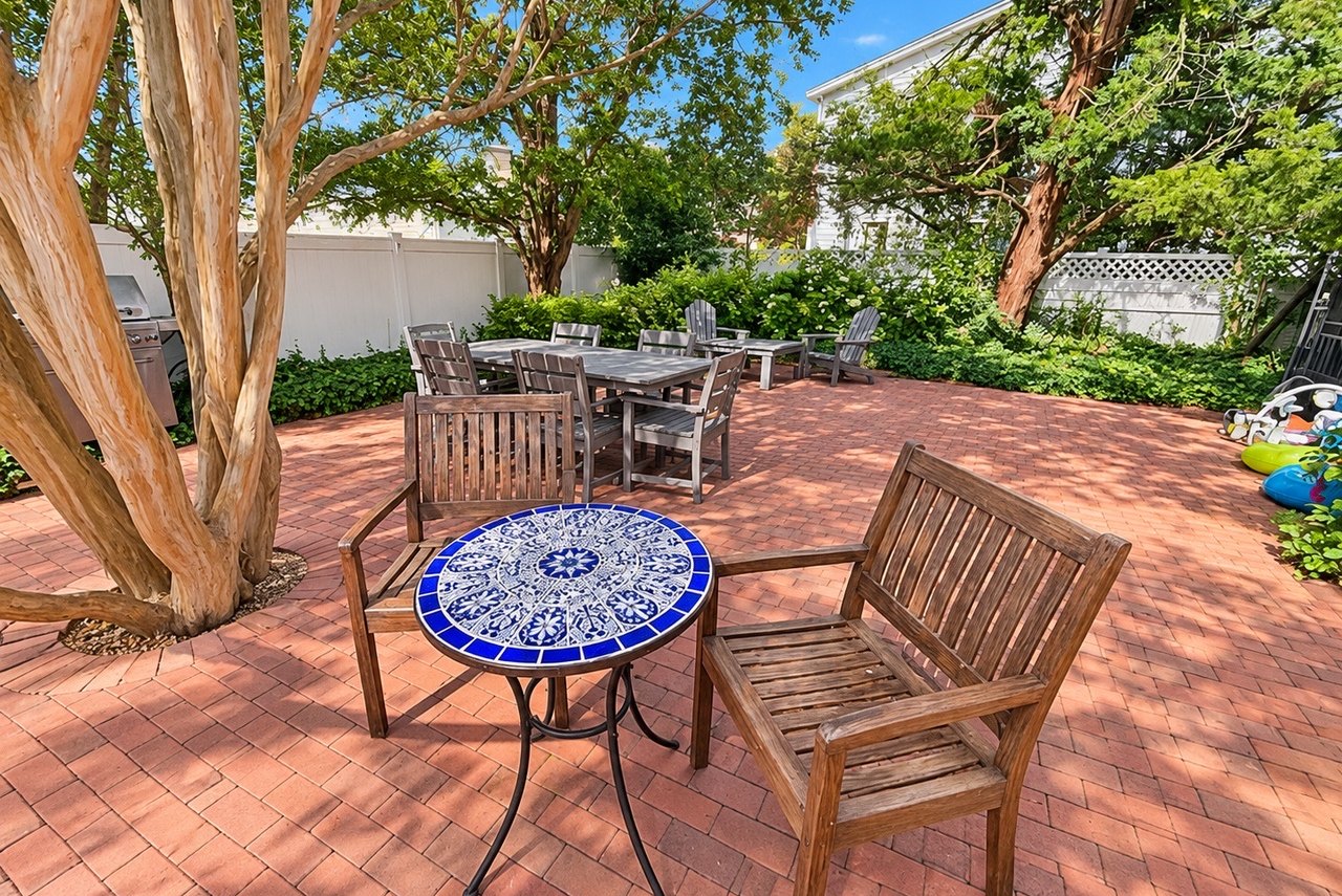 Brick courtyard with bistro table and dining area