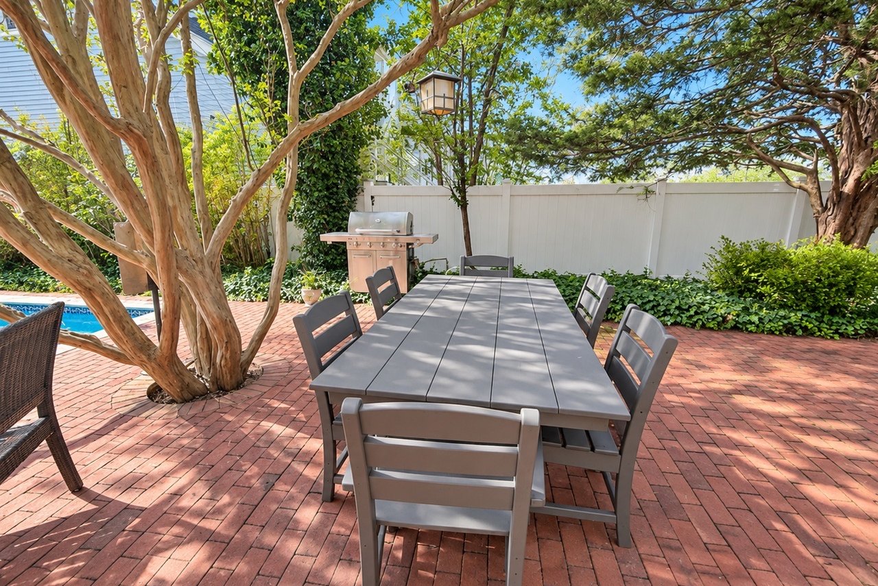 Garden patio with dining area and grill
