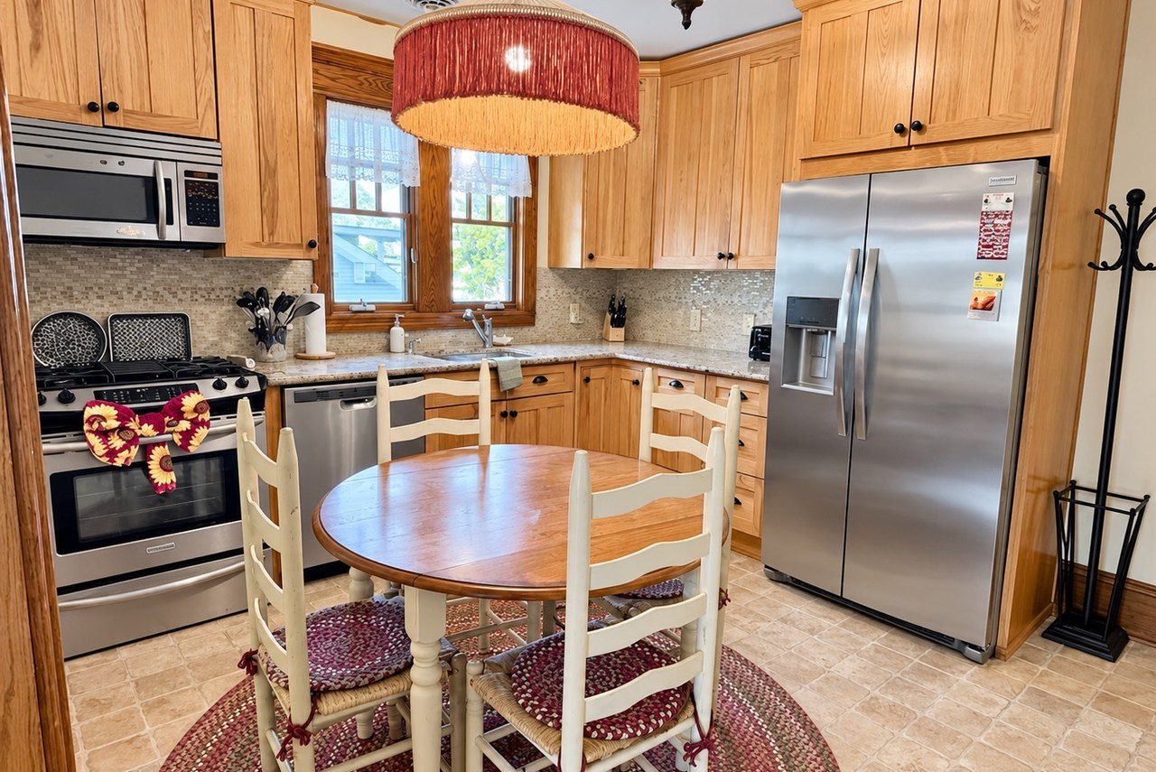 Full kitchen with stainless appliances and granite counters