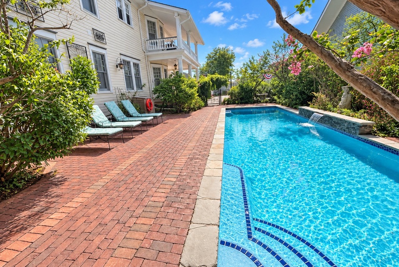 Pool framed by the Aster Inn gardens